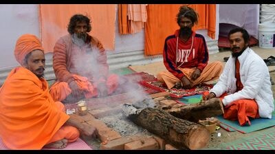 Saints overseeing setting up of their camps on plots of land allotted to organisations in mela area ahead of Mahakumbh in Prayagraj (HT Photo)