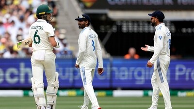 Australia's Sam Konstas (L) chats with India's Virat Kohli (R) on day one of the fourth cricket Test match between Australia and India at the Melbourne Cricket Ground (MCG) (AFP)