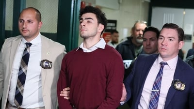 Luigi Mangione becomes unlikely fashion influencer as his burgundy sweater sells out day after court appearance (Photo by CHARLY TRIBALLEAU / AFP) (AFP)