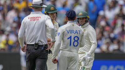 Virat Kohli gets into an altercation with Australia's Sam Konstas (2nd left) as Usman Khawaja looks on. (AP) Virat Kohli gets into an altercation with Australia's Sam Konstas (2nd left) as Usman Khawaja looks on. (AP)