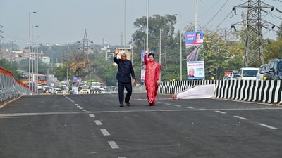 Delhi Chief Minister Atishi and Assembly Speaker Ram Niwas Goel walk on the newly inaugurated Anand Vihar flyover, in New Delhi on Wednesday. (ANI) Delhi Chief Minister Atishi and Assembly Speaker Ram Niwas Goel walk on the newly inaugurated Anand Vihar flyover, in New Delhi on Wednesday. (ANI)