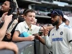 India's Virat Kohli poses for selfies on day two of the fourth cricket Test match