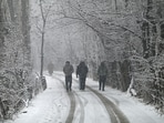 Kashmir: People walk during the first snowfall of the season in Srinagar, India on Friday , 27 December 2024. 