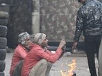 People gather around a bonfire on a cold morning in New Delhi. (Arvind Yadav/ HT Photo) People gather around a bonfire on a cold morning in New Delhi. (Arvind Yadav/ HT Photo)
