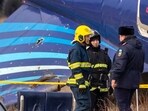 Emergency specialists work at the crash site of an Azerbaijan Airlines passenger jet near the western Kazakh city of Aktau on December 25, 2024. Emergency specialists work at the crash site of an Azerbaijan Airlines passenger jet near the western Kazakh city of Aktau on December 25, 2024.