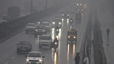 Vehicles ply on Delhi-Gurugram Expressway during rain on a cold winter day, in Gurugram on Friday. (ANI) Vehicles ply on Delhi-Gurugram Expressway during rain on a cold winter day, in Gurugram on Friday. (ANI)