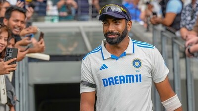 India's Jasprit Bumrah walks out before the start of play on the second day of the fourth cricket Test wearing a black armband (AP) India's Jasprit Bumrah walks out before the start of play on the second day of the fourth cricket Test wearing a black armband (AP)