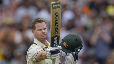 Australia's Steve Smith raises his bat as he celebrates after scoring his century on Friday. (AP) Australia's Steve Smith raises his bat as he celebrates after scoring his century on Friday. (AP)