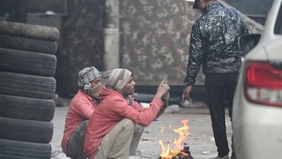 People gather around a bonfire on a cold morning in New Delhi. (Arvind Yadav/ HT Photo) People gather around a bonfire on a cold morning in New Delhi. (Arvind Yadav/ HT Photo)