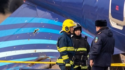 Emergency specialists work at the crash site of an Azerbaijan Airlines passenger jet near the western Kazakh city of Aktau on December 25, 2024. (AFP) Emergency specialists work at the crash site of an Azerbaijan Airlines passenger jet near the western Kazakh city of Aktau on December 25, 2024. (AFP)