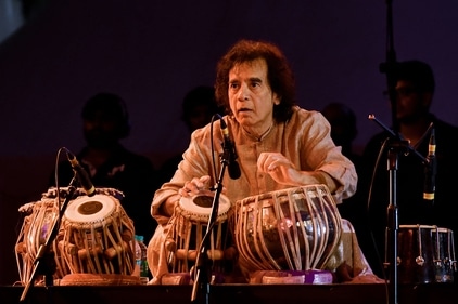 Table virtuoso Zakir Hussain performing during a concert at the Indian Music Experience (IME) in Bangalore on July 27, 2019. (AFP) Table virtuoso Zakir Hussain performing during a concert at the Indian Music Experience (IME) in Bangalore on July 27, 2019. (AFP)