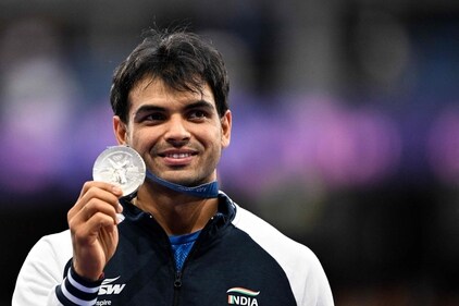 Neeraj Chopra celebrates his silver medal at the Paris Olympics 2024. (AFP) Neeraj Chopra celebrates his silver medal at the Paris Olympics 2024. (AFP)