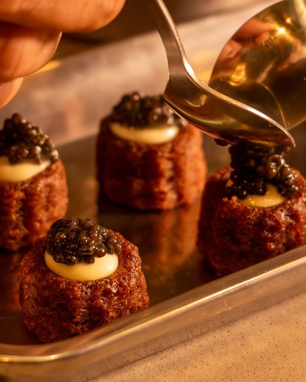 Papa’s chhena poda with caviar. Papa’s chhena poda with caviar.
