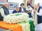 Union home minister Amit Shah pays his last respects to the mortal remains of former prime minister Manmohan Singh at his residence in New Delhi on Friday. Prime Minister Narendra is also present. 