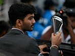 India's Gukesh Dommaraju poses with his trophy during a ceremonial parade. India's Gukesh Dommaraju poses with his trophy during a ceremonial parade.