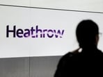 A member of the public waits in the arrivals hall at Terminal 5 of Heathrow Airport in London, Britain, December 5, 2023.