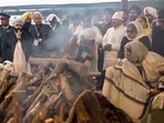 Former prime minister Manmohan Singh's wife Gursharan Kaur and daughter Upinder Singh during his state funeral at the Nigambodh Ghat in New Delhi on Saturday.