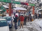 People stranded during traffic jam on the Jammu & Kashmir National Highway after fresh snowfall
