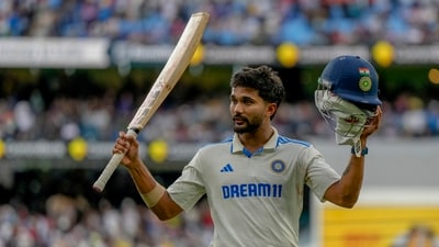 India's Nitish Kumar Reddy acknowledged the crowd as he walked off the field after bad light stopped play during play on the third day of the fourth cricket test (AP) India's Nitish Kumar Reddy acknowledged the crowd as he walked off the field after bad light stopped play during play on the third day of the fourth cricket test (AP)