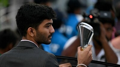 India's Gukesh Dommaraju poses with his trophy during a ceremonial parade. (AFP) India's Gukesh Dommaraju poses with his trophy during a ceremonial parade. (AFP)