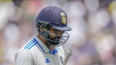 India captain Rohit Sharma walks off the field after getting dismissed during Day 2 of the fourth Test against Australia. (AP) (HT_PRINT)