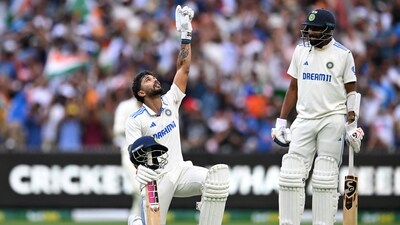 India's Nitish Kumar Reddy celebrates his century as Mohammed Siraj looks on. (AAP Image via REUTERS)