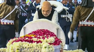 Union home minister Amit Shah pays his last respects to former prime minister Manmohan Singh during the latter's state funeral, at the Nigambodh Ghat in New Delhi (PTI) Union home minister Amit Shah pays his last respects to former prime minister Manmohan Singh during the latter's state funeral, at the Nigambodh Ghat in New Delhi (PTI)