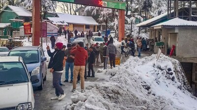 People stranded during traffic jam on the Jammu & Kashmir National Highway after fresh snowfall (PTI) People stranded during traffic jam on the Jammu & Kashmir National Highway after fresh snowfall (PTI)