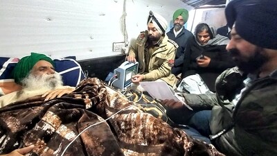 Police officials meet farmer leader Jagjit Singh Dallewal who is fasting unto death. (ANI file photo) Police officials meet farmer leader Jagjit Singh Dallewal who is fasting unto death. (ANI file photo)