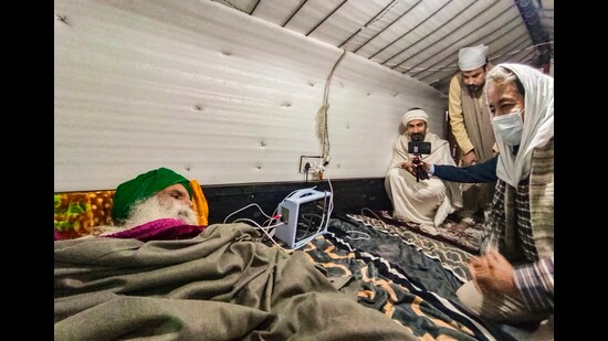 Climate activist Sonam Wangchuk visits farmer leader Jagjit Singh Dallewal, who is on an indefinite hunger strike at Khanauri border for over a month, in Sangrur on Saturday. (PTI)