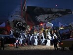 Firefighters and rescue personnel at the site of a Jeju Air plane crash at Muan International Airport 