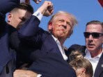 Secret Service agents shield Donald Trump moments after he was shot at his rally in Butler, Pennsylvania, on July 14 (AP) Secret Service agents shield Donald Trump moments after he was shot at his rally in Butler, Pennsylvania, on July 14 (AP)