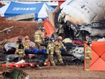 Firefighters carry the body of a passenger from the wreckage of an aircraft that crashed after it went off the runway at Muan International Airport, in Muan, South Korea, December 29, 2024. Firefighters carry the body of a passenger from the wreckage of an aircraft that crashed after it went off the runway at Muan International Airport, in Muan, South Korea, December 29, 2024.