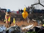 A life jacket hangs on fencing next to the wreckage of an aircraft that crashed after it went off the runway at Muan International Airport, in Muan, South Korea, December 29, 2024.