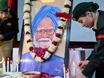 TOPSHOT - National Cadet Corps (NCC) cadets light candles to pay their respect to India's late former Prime Minister Manmohan Singh at Hindu College, Singh's alma mater, in Amritsar on December 28, 2024. (Photo by Narinder NANU / AFP)