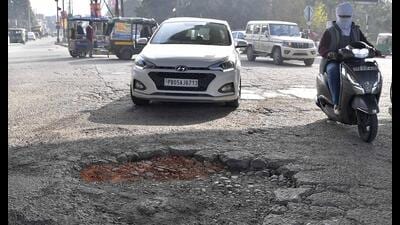 A damaged road from Partap Chowk to Janta Nagar in Ludhiana on Sunday. (Manish/HT)