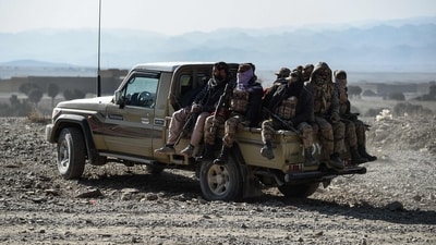 Taliban security personnel sit on the back of a vehicle. (AFP) Taliban security personnel sit on the back of a vehicle. (AFP)