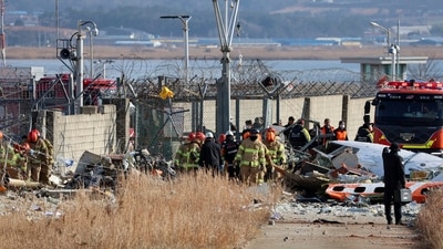 Firefighters and rescue team members work at Muan International Airport in Muan, South Korea. (AP) Firefighters and rescue team members work at Muan International Airport in Muan, South Korea. (AP)