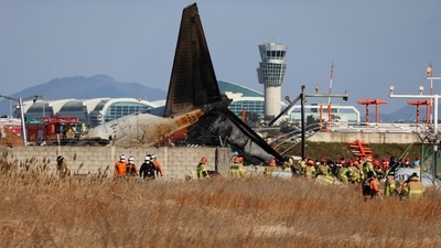 South Korea Plane Crash: Firefighters and rescue team members work at Muan International Airport in Muan, South Korea. (AP) South Korea Plane Crash: Firefighters and rescue team members work at Muan International Airport in Muan, South Korea. (AP)