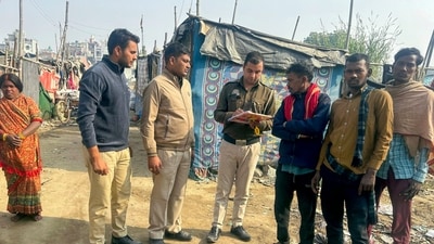 Delhi Police officials check documents of people during a verification drive to identify illegal Bangladeshi immigrants (PTI) Delhi Police officials check documents of people during a verification drive to identify illegal Bangladeshi immigrants (PTI)