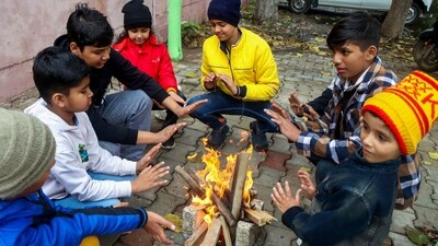 Rohtak: Children sit around a bonfire to keep themselves warm on a cold winter day. (PTI file photo) Rohtak: Children sit around a bonfire to keep themselves warm on a cold winter day. (PTI file photo)