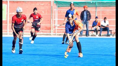 Players in action during a hockey match at PAU in Ludhiana on Sunday. (Manish/HT)