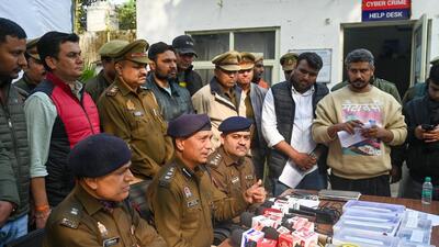 Police said that ₹2.5 lakh in cash, documents, e-commerce big-basket e-rickshaw, two two-wheelers, and four illegal country-made firearms were recovered from their possession. (Sunil Ghosh/HT Photo) Police said that ₹2.5 lakh in cash, documents, e-commerce big-basket e-rickshaw, two two-wheelers, and four illegal country-made firearms were recovered from their possession. (Sunil Ghosh/HT Photo)