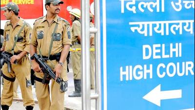 Police stand guard in front of Delhi high court in New Delhi. Police stand guard in front of Delhi high court in New Delhi.