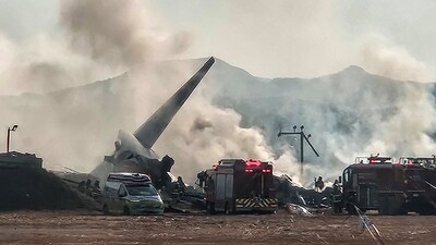 Firefighters carry out extinguishing operations on an aircraft which drove off runway at Muan International Airport in Muan, South Jeolla Province, South Korea. (REUTERS)