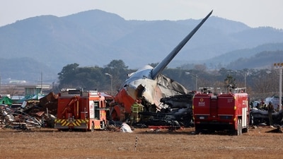 Firefighters and rescue team members work at Muan International Airport in Muan, South Korea after the plane caught fire. (AP) Firefighters and rescue team members work at Muan International Airport in Muan, South Korea after the plane caught fire. (AP)