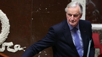 French Prime Minister Michel Barnier leaves after delivering a speech during the debate prior to the no-confidence votes on his administration at the National Assembly in Paris on December 4, 2024. (Photo by Alain JOCARD / AFP) (AFP) French Prime Minister Michel Barnier leaves after delivering a speech during the debate prior to the no-confidence votes on his administration at the National Assembly in Paris on December 4, 2024. (Photo by Alain JOCARD / AFP) (AFP)