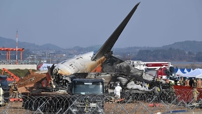 Firefighters and rescue personnel work near the wreckage of a Jeju Air Boeing 737-800 series aircraft after the plane crashed and burst into flames at Muan International Airport in South Jeolla Province, some 288 kilometres southwest of Seoul on December 29, 2024. (AFP) Firefighters and rescue personnel work near the wreckage of a Jeju Air Boeing 737-800 series aircraft after the plane crashed and burst into flames at Muan International Airport in South Jeolla Province, some 288 kilometres southwest of Seoul on December 29, 2024. (AFP)