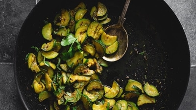 Method: Add oil, mustard, asafoetida, curry leaves and chilli to prepare the tadka. Now, add the chopped zucchini with salt. Toss the vegetable and tadka and cover it for 2 minutes. Add coriander powder, cumin powder, amchur powder and fennel powder. Add grated coconut and cook. Finish off with lots of fresh coriander (Representative photo: Jcookingodyssey.com) Method: Add oil, mustard, asafoetida, curry leaves and chilli to prepare the tadka. Now, add the chopped zucchini with salt. Toss the vegetable and tadka and cover it for 2 minutes. Add coriander powder, cumin powder, amchur powder and fennel powder. Add grated coconut and cook. Finish off with lots of fresh coriander (Representative photo: Jcookingodyssey.com)