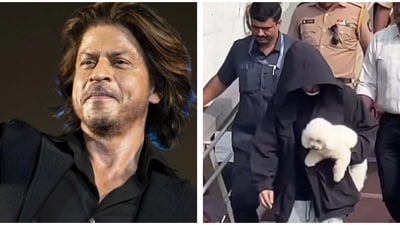 Shah Rukh Khan was spotted holding a dog in his hands. Shah Rukh Khan was spotted holding a dog in his hands.